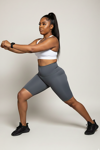 Gray high waisted biker shorts 8 inch inseam - front view on model