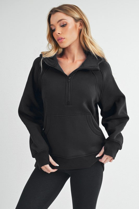 AEMI CO Half Zip Sweatshirt in gray with a relaxed fit, raglan sleeves, and a kangaroo pocket – perfect for athleisure and everyday wear.