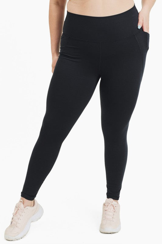 Black high waisted leggings for curvy women with tapered waistband
