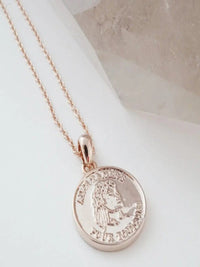 Dainty gold necklace styled as everyday minimalist jewelry
