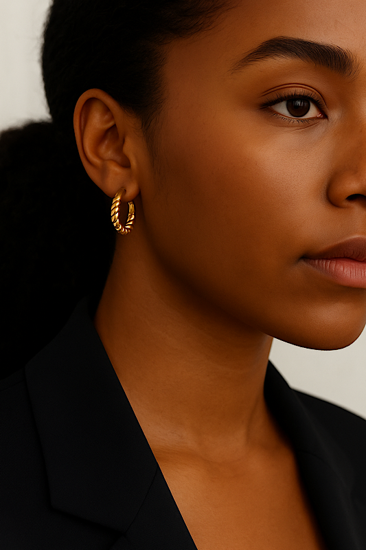 Model wearing 18K gold twisted huggie hoop earrings – Spoiled Me Rotten